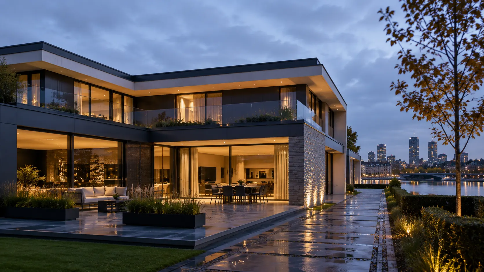 A contemporary waterfront villa at dusk after rain, floor-to-ceiling glazing lit from inside, the city skyline across the water.